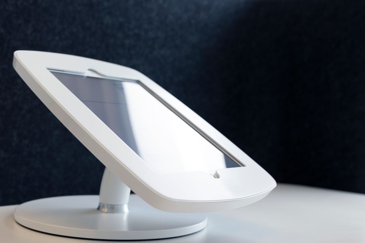 Mastering the First Impression: Your intriguing post title goes here Close-up of a sleek tablet stand on a table, showcasing modern design in technology.