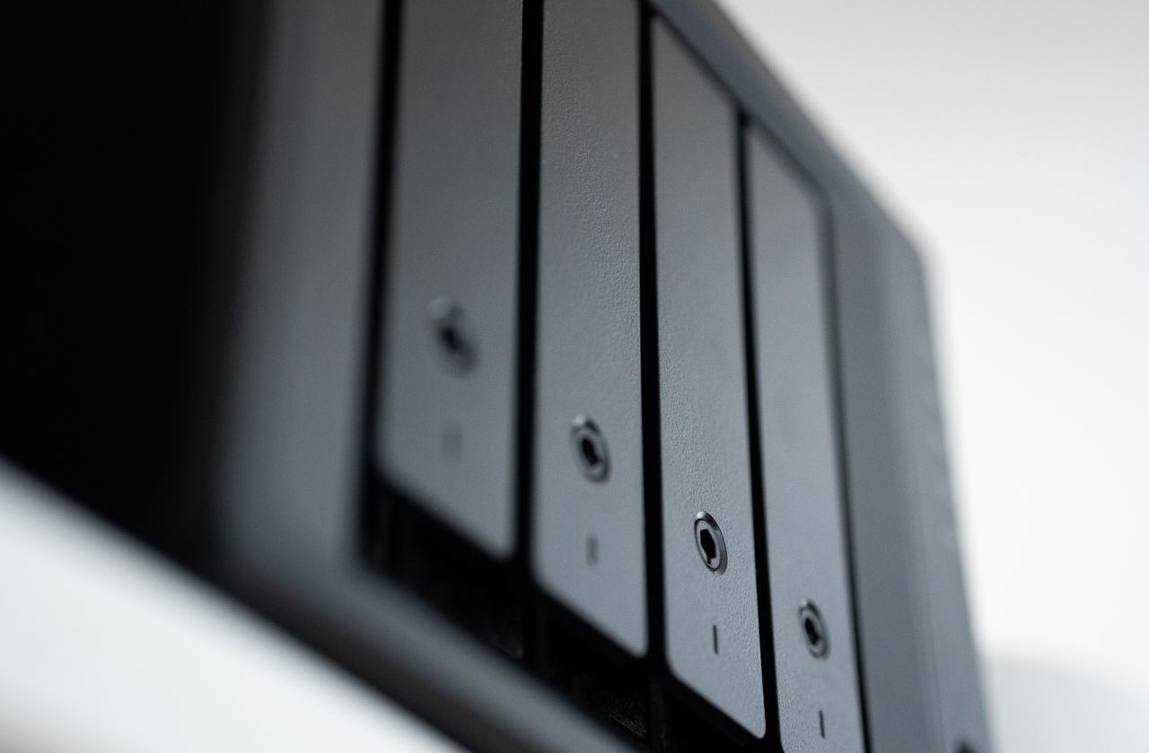 Services Detailed view of a black data storage unit highlighting modern technology and data management.